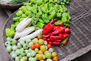 Tomatos, peppers, turnips and other vegetables sold in a Cambodian food street market