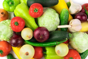 Ripe fresh vegetables in a large assortment on a white background with water drops. Food background. The view from the top. The concept of natural products, proper nutrition.