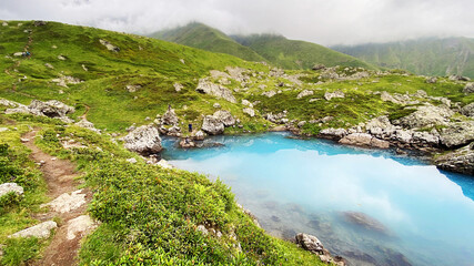 Fototapeta na wymiar Travel to the mountainous region of Georgia and blue lake