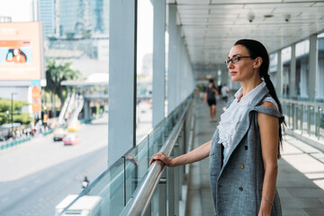 Business woman looking at city stock photo