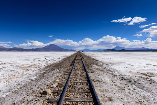 Train track across the Uyuni Salt flat, Altiplano, Bolivia