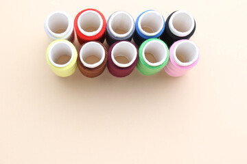 Accessories for sewing. Colored spools of thread.