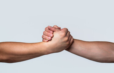 Friendly handshake, friends greeting, teamwork, friendship. Rescue, helping gesture or hands. Two...
