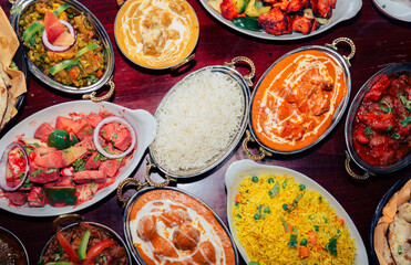 assorted indian curry and rice dishes