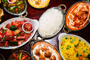 assorted indian curry and rice dishes