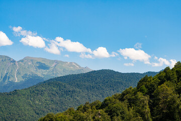Fototapeta na wymiar mountain landscape. Green mountains against a blue sky.