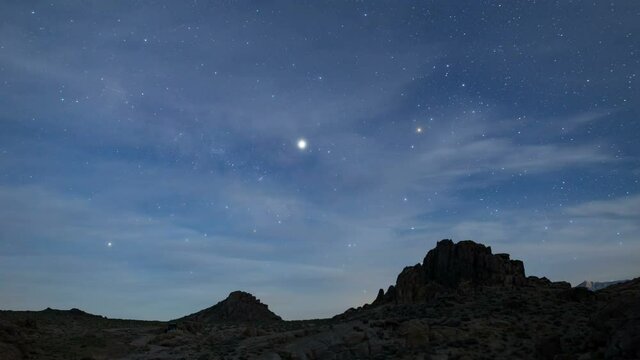  Astro Timelapse of Milky Way galaxy revealed as the moon sets behind Sierra Nevada mountains in Alabama Hills, California