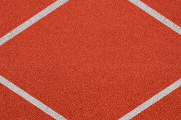 Top view of the running track rubber lanes cover texture with white line marking for background.