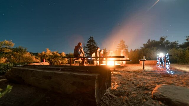  Astro timelapse tracking shot of bonfire at campsite in Angeles National Forest, California