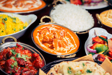 assorted indian curry and rice dishes