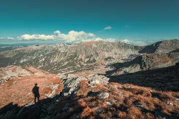 Fototapeta na wymiar A shadow of a man on the mountain beautiful wide angle landscape
