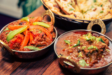 assorted indian curry and rice dishes shot from overhead composition