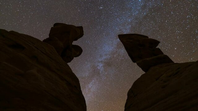  Time lapse tracking shot of Milky Way galaxy over hoodoos at Devils Garden in Grand Staircase Escalante National Monument in Utah