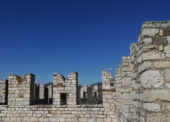 Battlements standing out against the sky.