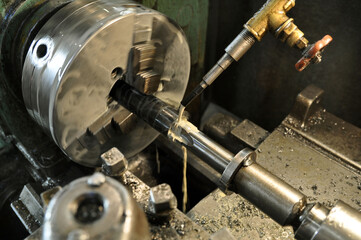 Metalworking machine at work. Lubricating and cooling fluid