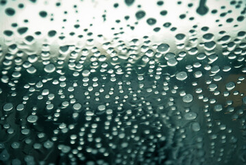 Soap foam bubbles on the glass