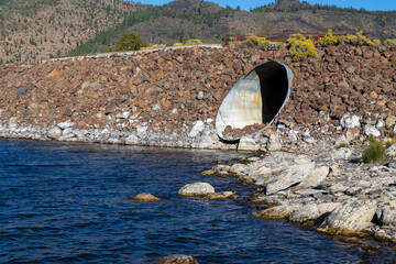 Eagle Lake water below large culvert in the Gallatin Marina breakwater illustrating severe drought...