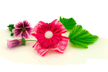 Barrette with elastic and pink ribbon, flowers and green leaf isolated on white background. - 376960863