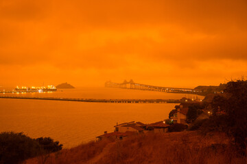 Richmond - San Rafael Bridge in orange smoke and fog from Northern California wildfires