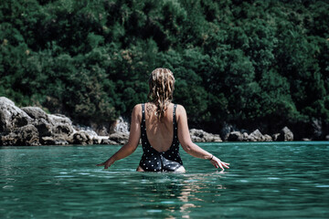 Fototapeta premium Swimming in the green waters of Greece