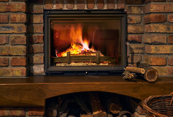 fireplace and fire close view as object or background, brick wall