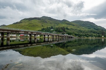 Obraz premium The A87 road bridge above Loch Long in Dornie town in Scotland near the famous Eilean Donan Castle