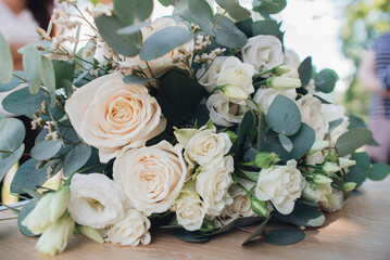 wedding bouquet of roses with eucalyptus and eustoma