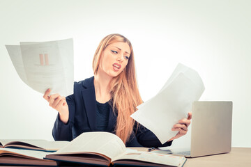 Blond woman feeling stress because of paper work at office
