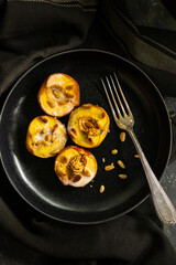 Baked apricots with coconut milk and nuts 