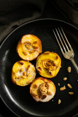 Baked apricots with coconut milk and nuts 