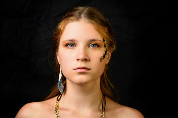 Portrait of beautiful sensual redhead girl in Studio on dark background