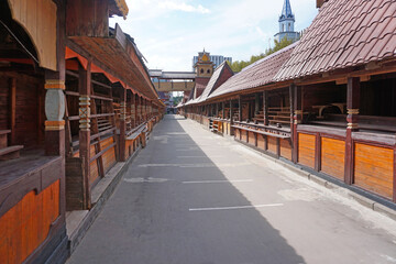 Closed wooden market stand stalls in an empty square