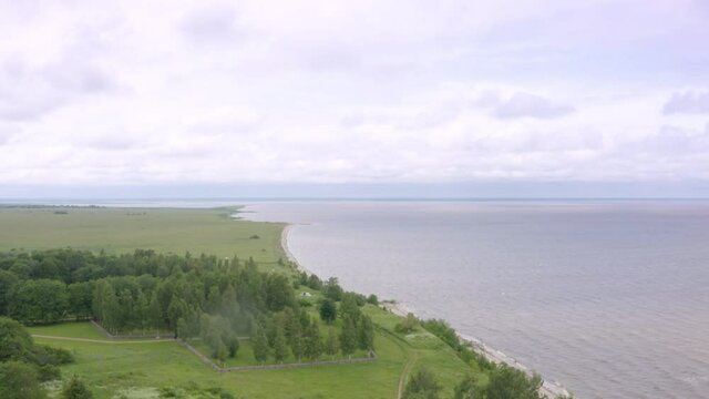 Panoramic aerial view of Lake Ilmen near Veliky Novgorod, natural attractions of Russia. Strong wind and waves on a sunny summer day.