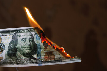 Burning dollar bill close up, copy space