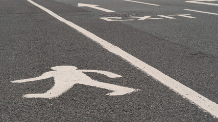 Pedestrian walkway in a busy car park or road