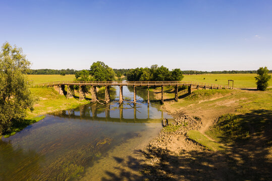 Aerial view of old wood bridge crossing Odra river at Odransko Polje, Croatia.
