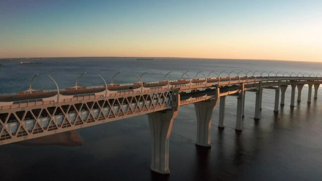 High-speed toll road, highway bypassing the city center St. Petersburg, the central section of the western high-speed section. A beautiful view of the sunset over the Gulf of Finland.