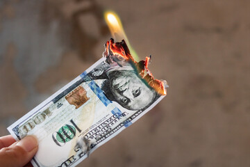 Burning dollar bill close up, copy space