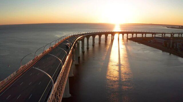 High-speed toll road, highway bypassing the city center St. Petersburg, the central section of the western high-speed section. A beautiful view of the sunset over the Gulf of Finland.