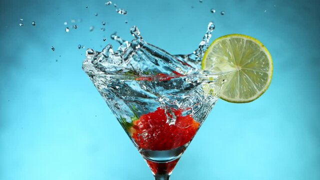 Super Slow motion shot of ice cube splashing into Dry Martini Drink, 1000 fps