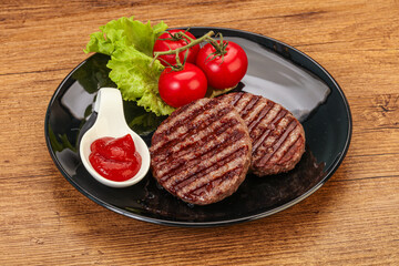 Grilled burger cutlet with sauce