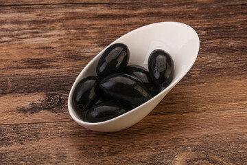 Pickled black olives in the bowl