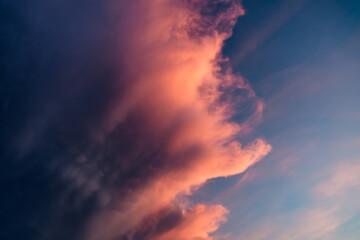 Fototapeta premium Nature background with small mammatus clouds, right before thunderstorm. Dark dramatic sky with stormy violet clouds before the rain