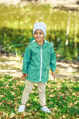 Portrait of little boy in autumn park