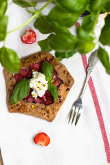 Strawberry galette with basil and pistachio 
