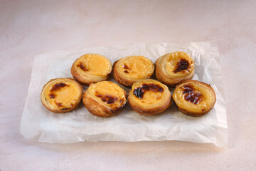 Traditional Portuguese popular dessert Pastel de nata or Pastel de Belem. Delicious puff pastry cups with custard. Gastronomic travel in Portugal.