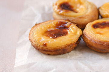 Traditional Portuguese popular dessert Pastel de nata or Pastel de Belem. Delicious puff pastry cups with custard. Closeup.