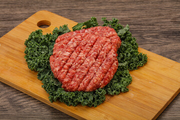 Raw beef burger cutlet for cooking