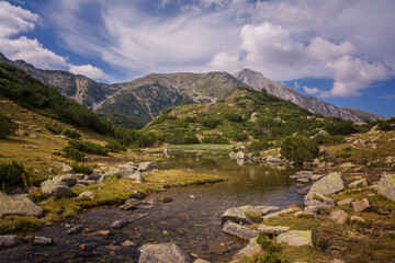 Fototapeta na wymiar Panoramic view of mountain lake in Pirin mountains, Bulgaria.