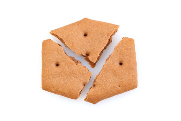 Sweet crackers with cocoa isolated on white background. Broken crackers. Close-up